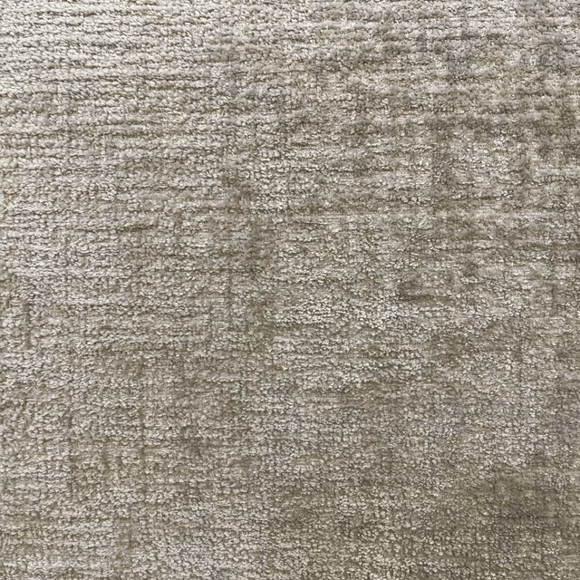 Mottled taupe-grey chenille with irregular horizontal texture and softly varied depth