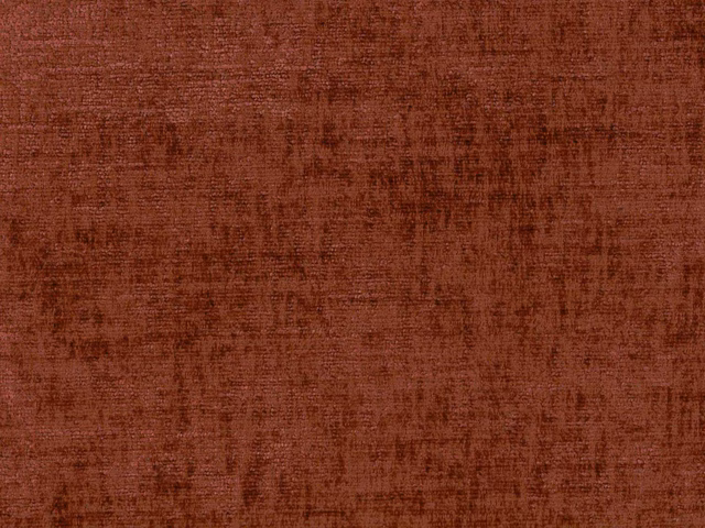 Close-up of deep rust terracotta chenille with a softly mottled brushed texture
