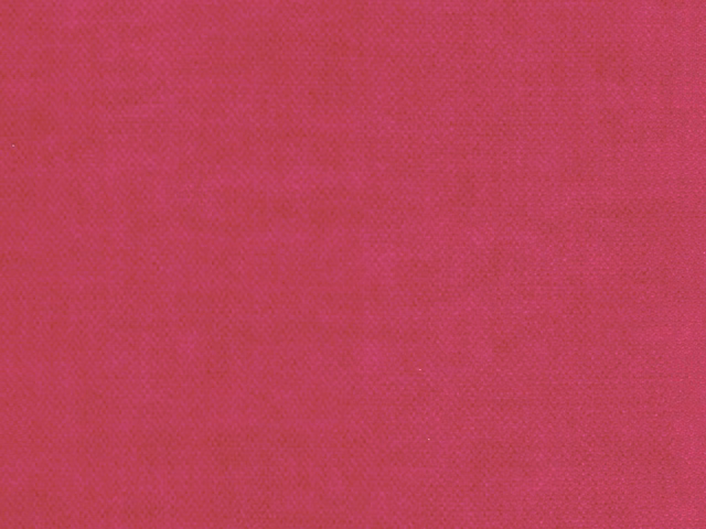 Close-up of saturated deep magenta pink velvet with subtle directional pile texture