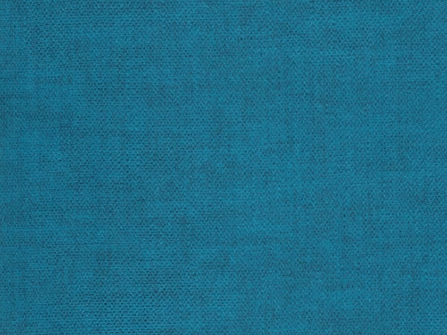 Close-up of turquoise-teal velvet with a softly mottled, directional pile