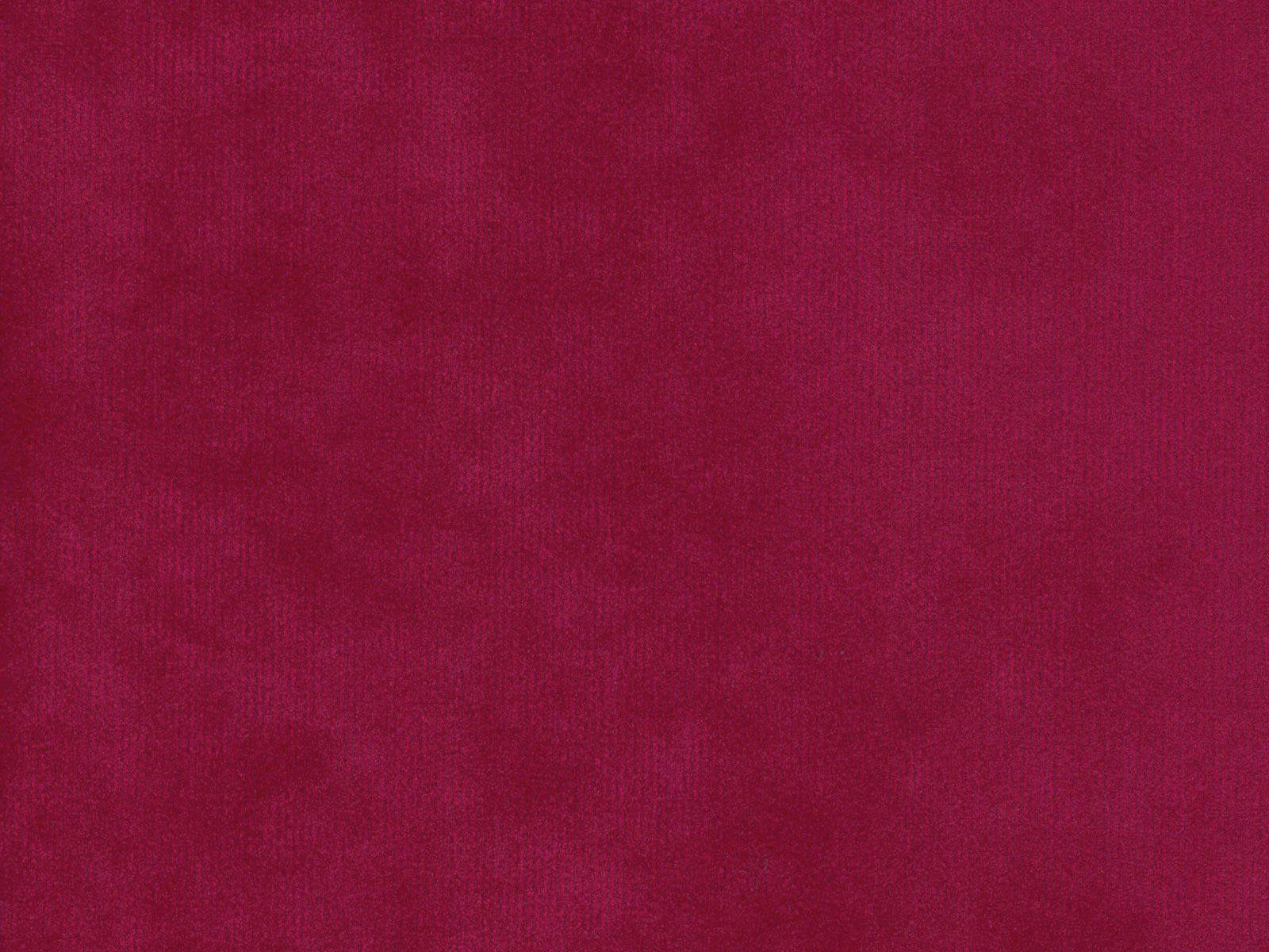 Deep magenta velvet showing a softly shifting plain pile and darker wine-toned shading