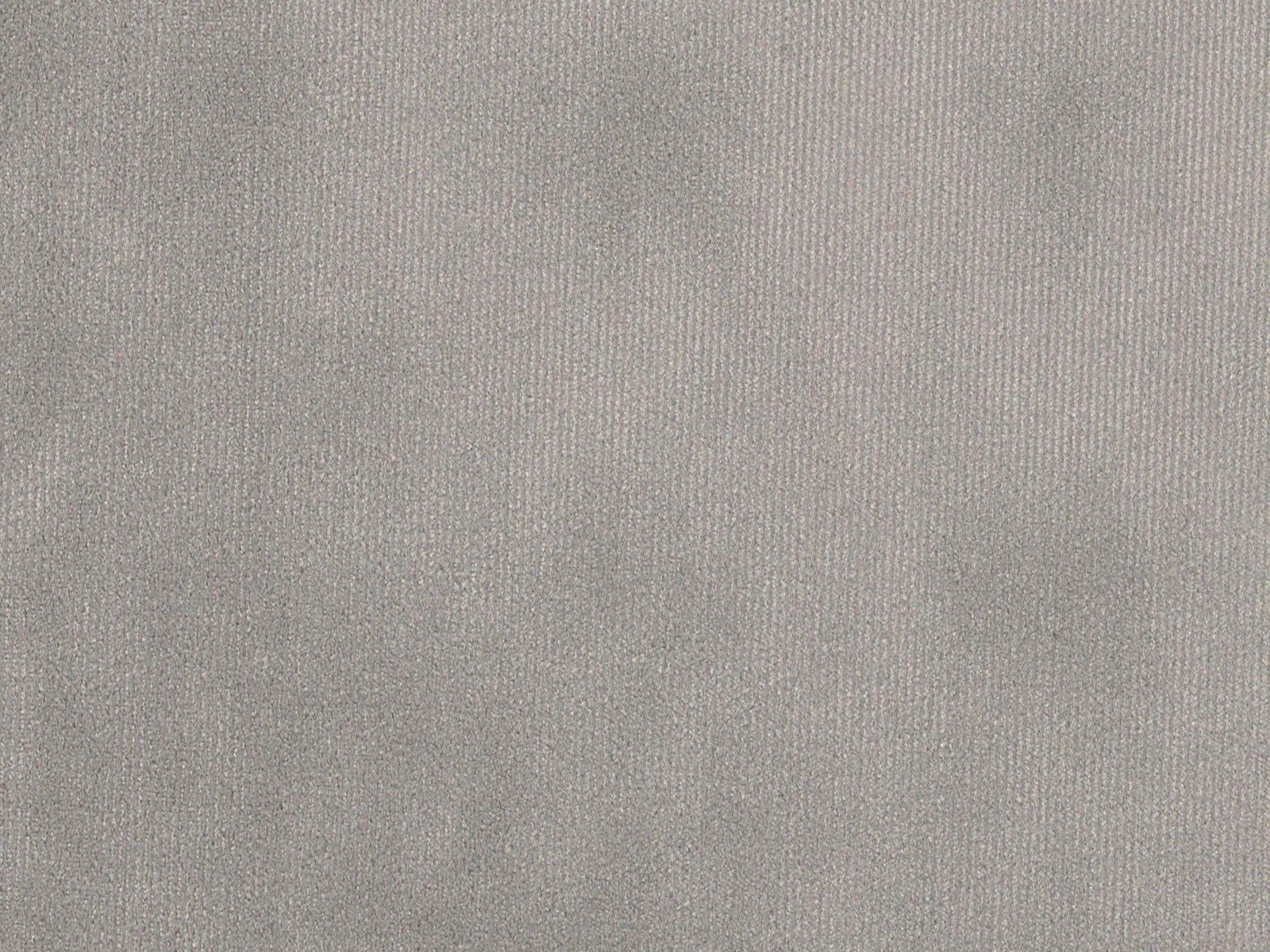Close-up of soft taupe-grey velvet with fine pile and subtle silvery shading