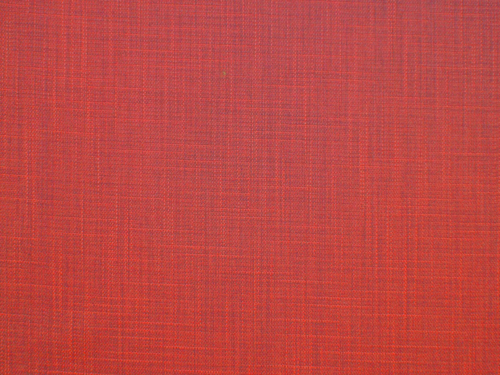 Warm brick-red faux-linen fabric with a fine crosswoven texture