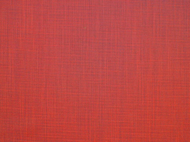 Warm brick-red faux-linen fabric with a fine crosswoven texture
