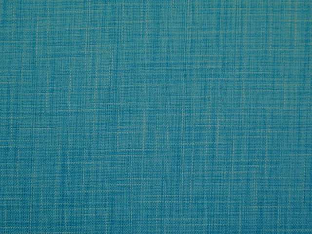 Close-up of muted blue teal faux-linen weave with fine crosshatch texture