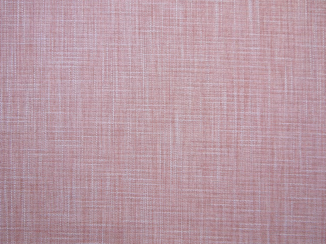 Dusty blush-pink faux linen with a fine irregular woven crosshatch texture