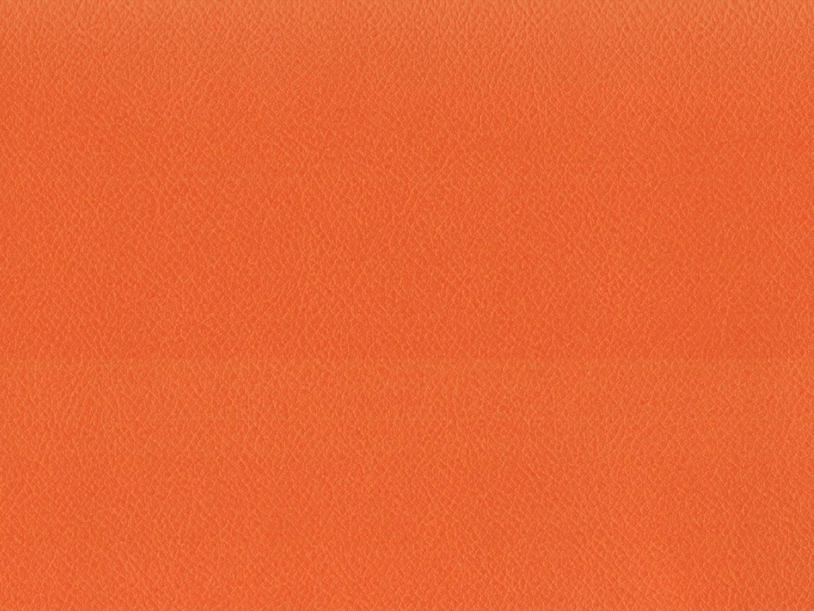 Warm coral-orange faux leather showing a subtle, even pebbled grain