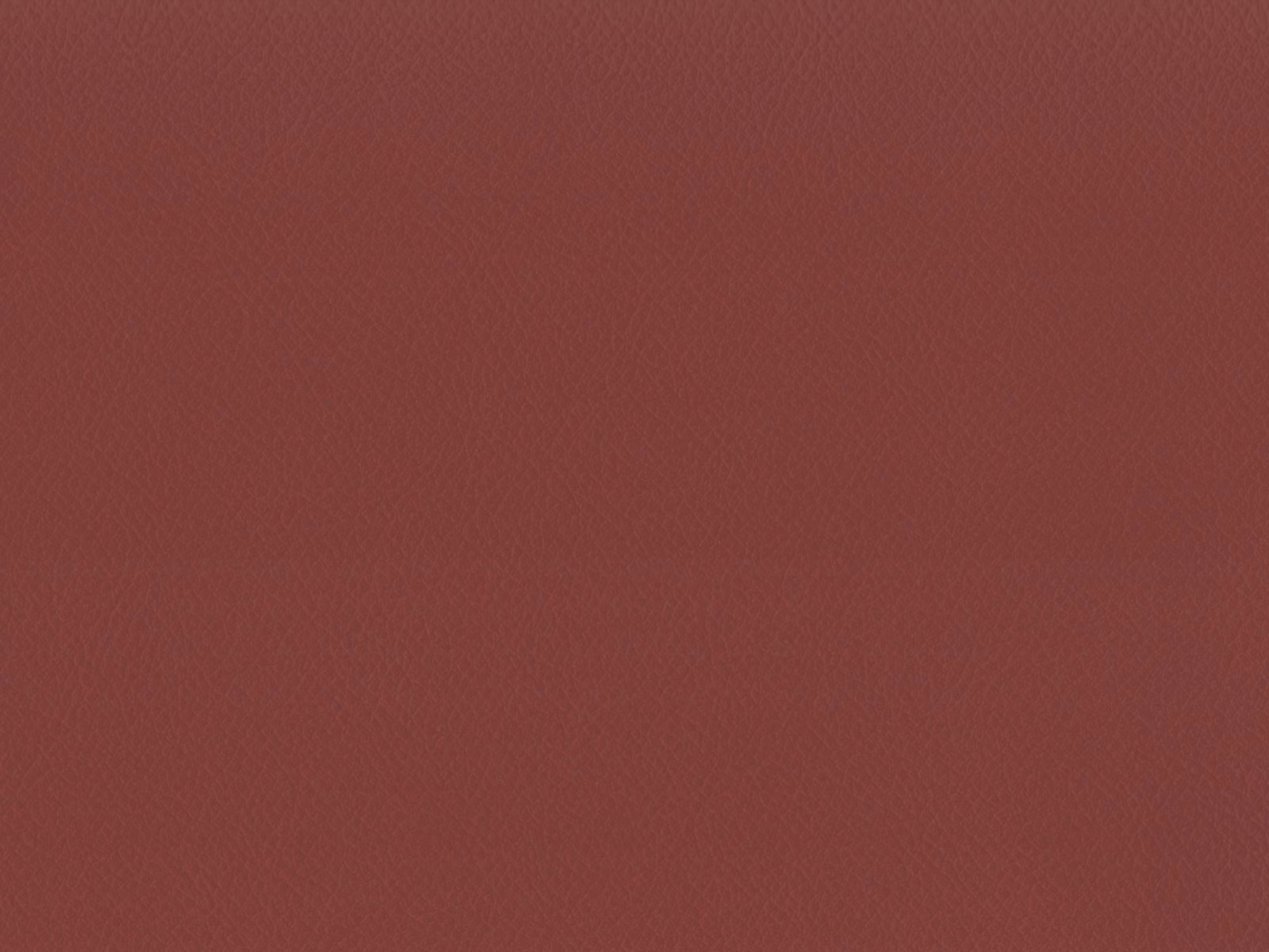 Muted brick-red faux leather with a fine, even grain