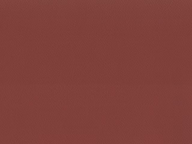Muted brick-red faux leather with a fine, even grain