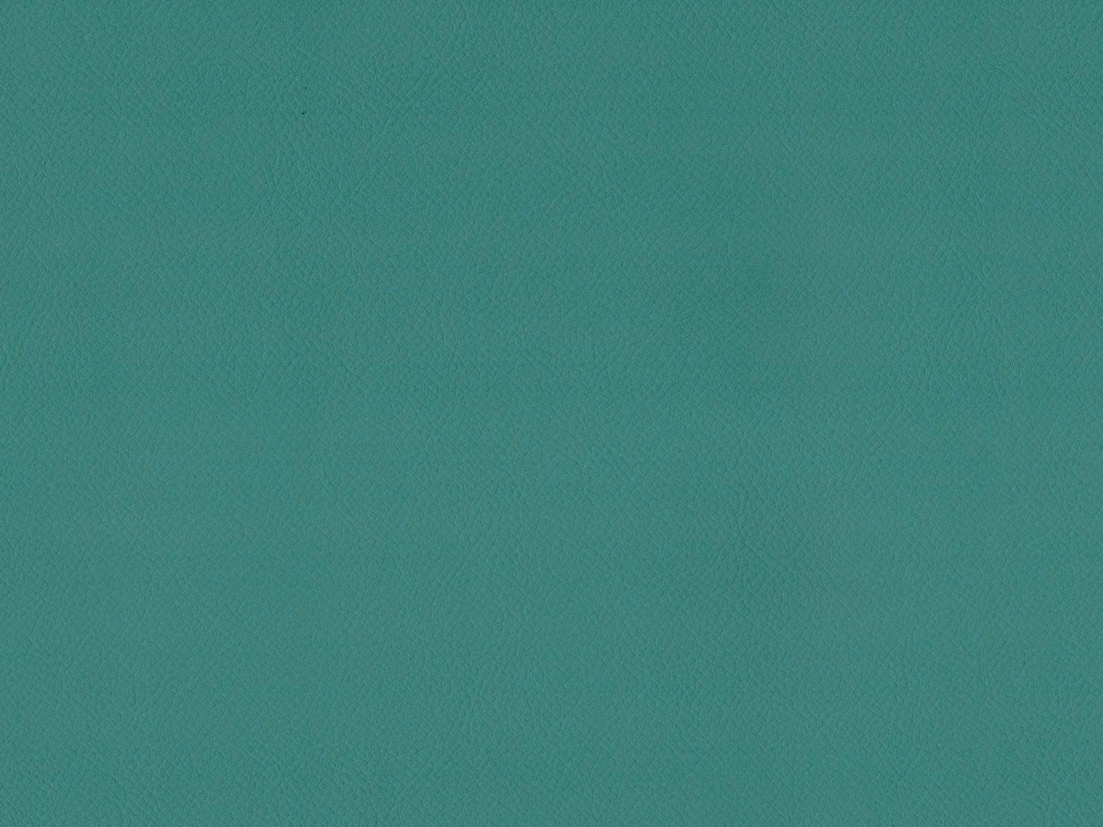 Close-up of blue-green teal faux leather with a subtle fine-grained surface