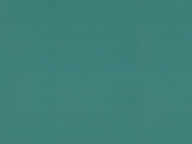 Close-up of blue-green teal faux leather with a subtle fine-grained surface
