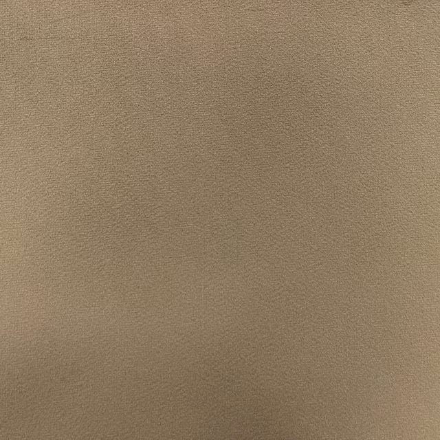 Warm taupe plain velvet showing a soft directional nap and restrained sheen