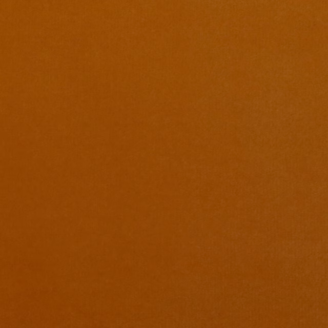 Deep burnt-orange velvet swatch showing a softly shaded, close-cut pile