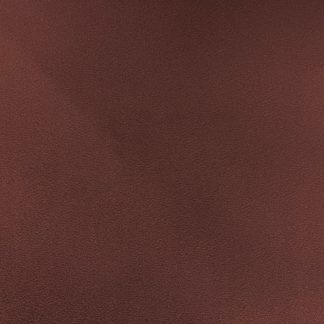 Deep burgundy-brown velvet showing fine directional pile and a subtle soft sheen
