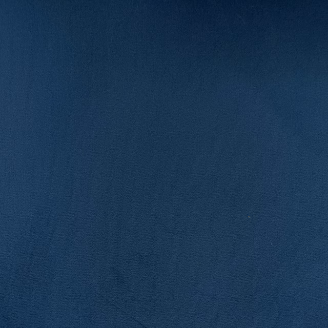 Deep navy blue velvet with subtle nap variation and a fine woven surface