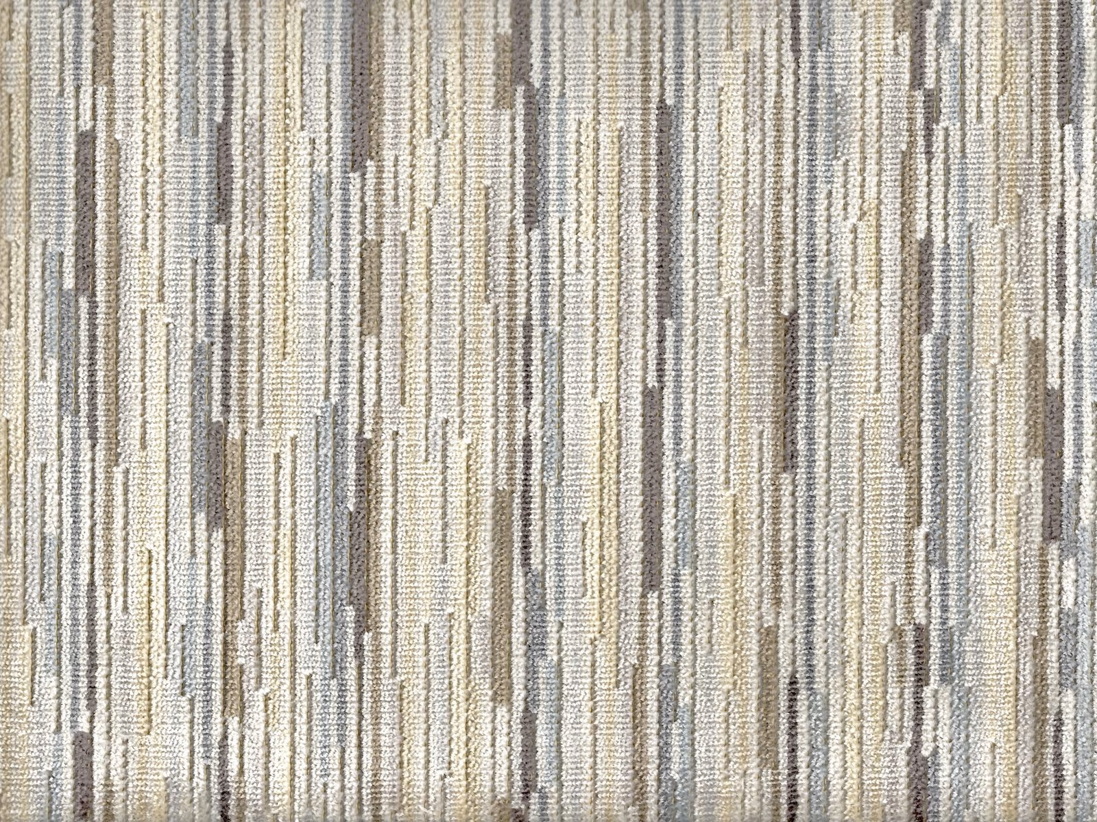 Pale taupe and ivory velvet with broken vertical striations and subtle sheen