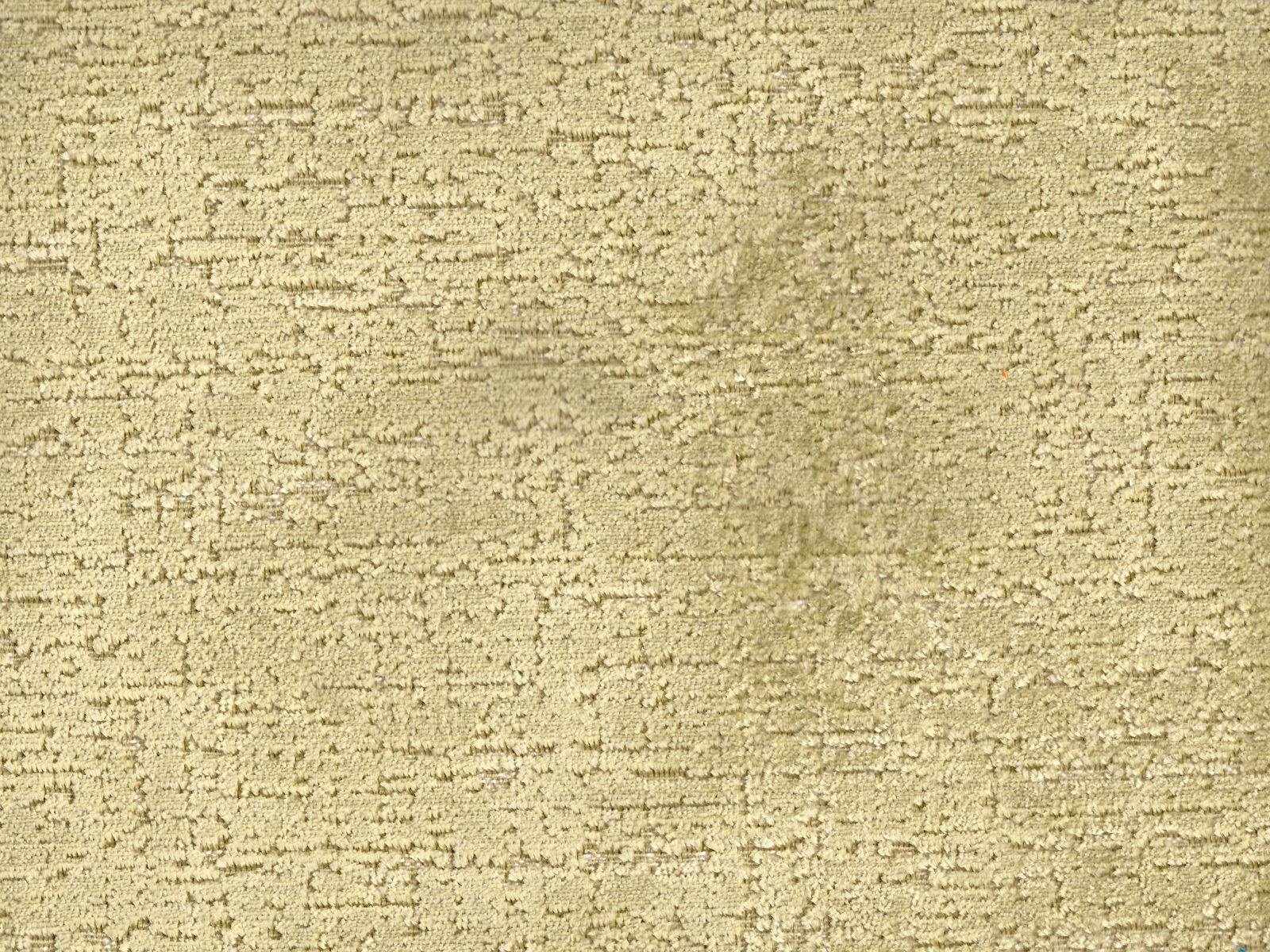 Muted olive-beige velvet with broken horizontal texture and softly shaded depth