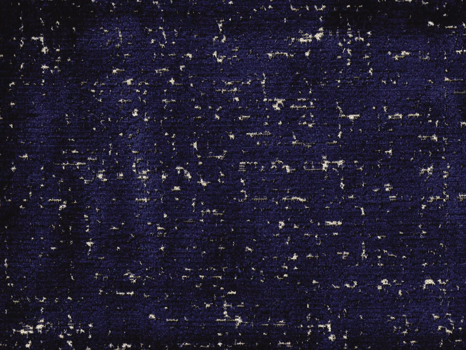 Deep indigo velvet with irregular pale flecks and broken horizontal texture