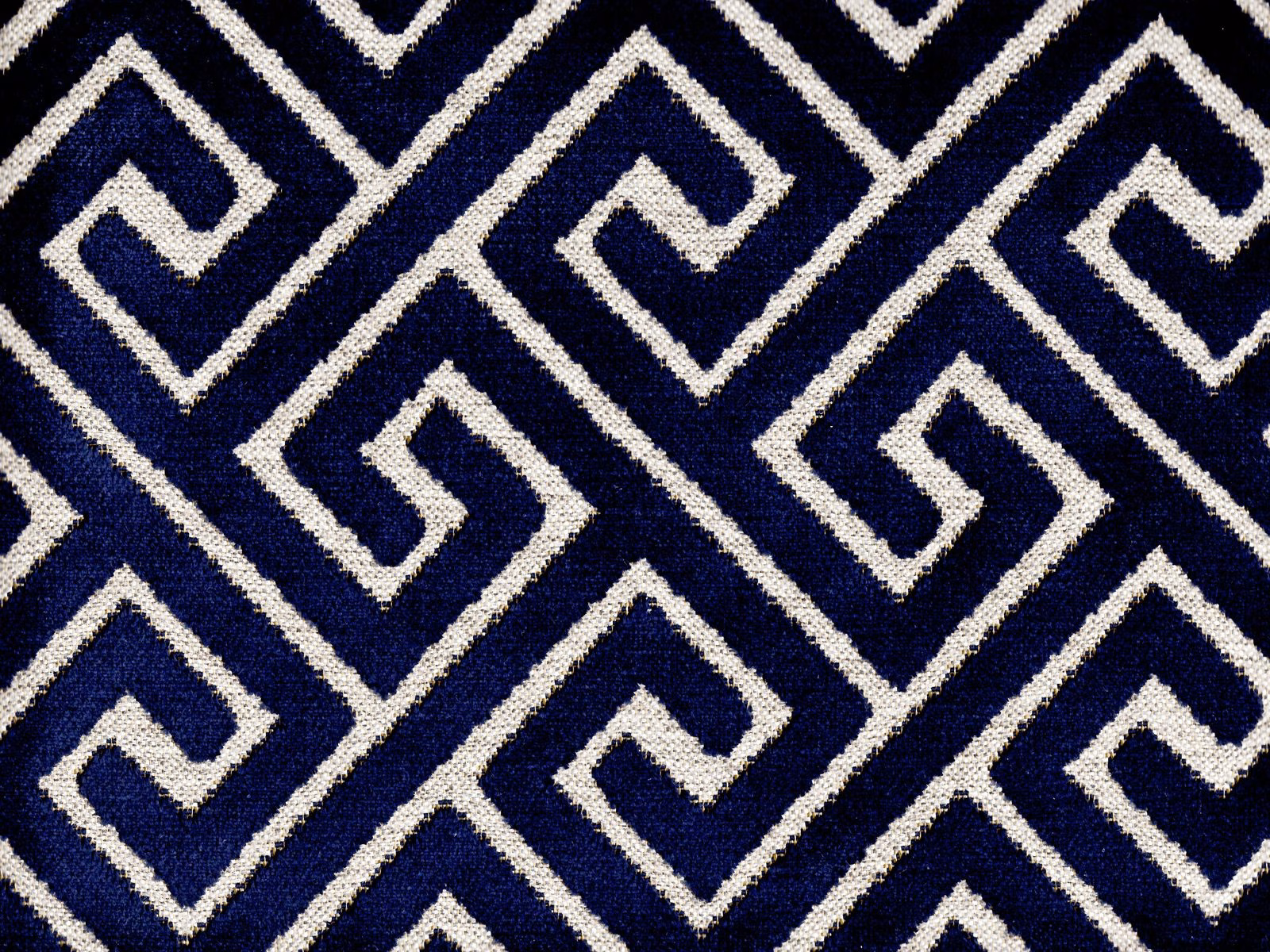 Deep navy velvet with ivory interlocking maze lines and a softly textured pile