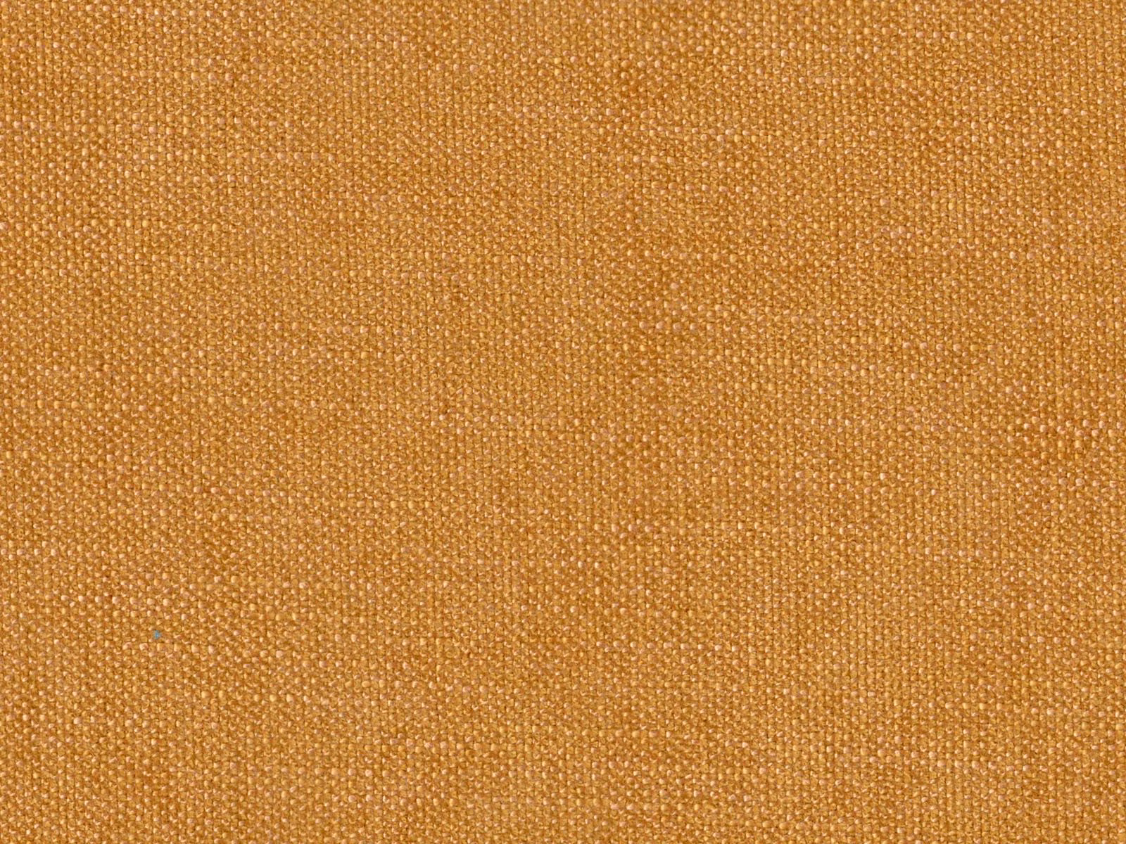 Close-up of warm golden-ochre chenille showing a dense, softly varied woven texture