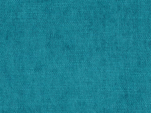 Close-up of blue-green teal chenille with a fine, softly mottled woven texture