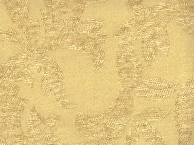 Pale gold chenille with large tonal botanical leaves and a softly raised weave