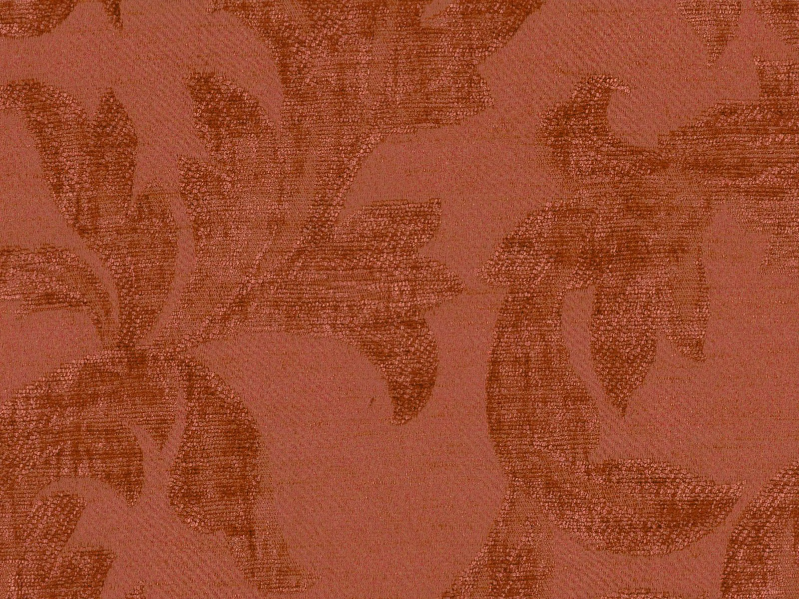 Muted terracotta chenille with dark rust botanical leaf forms and a tactile woven texture