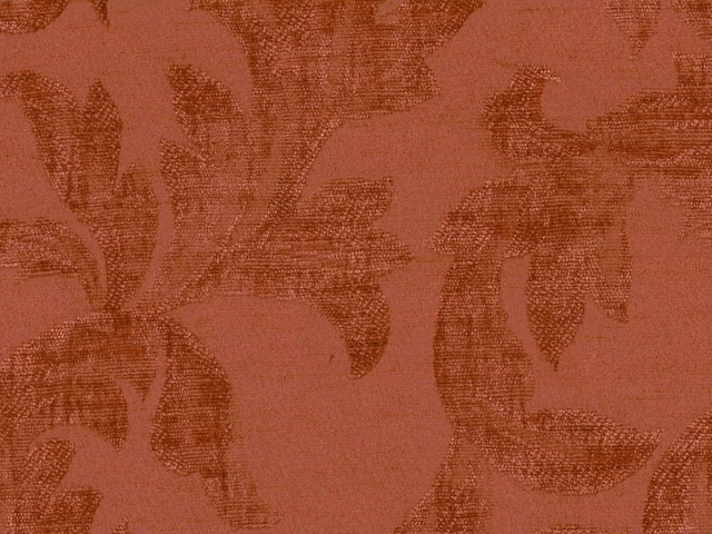 Muted terracotta chenille with dark rust botanical leaf forms and a tactile woven texture