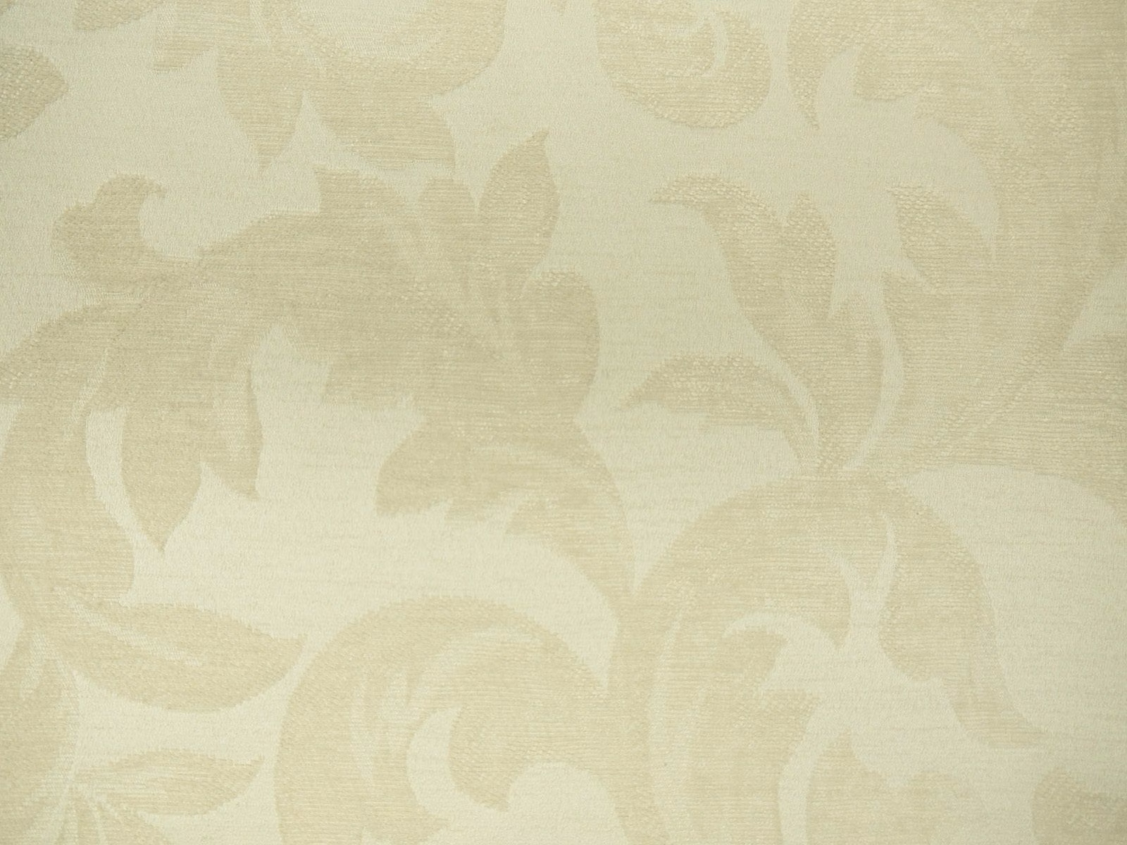 Warm ivory chenille with softly woven beige botanical leaves and large tonal floral shapes