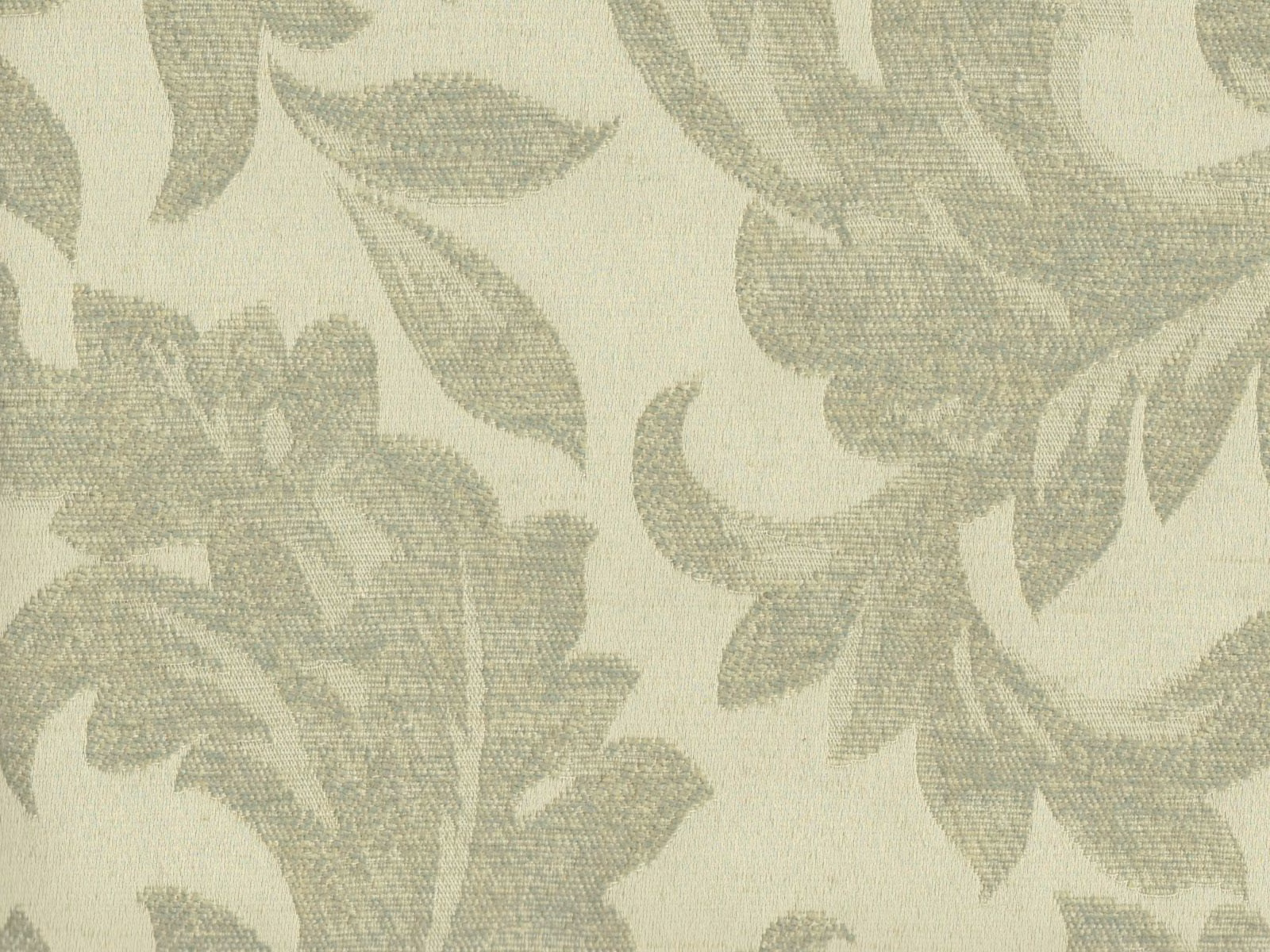 Pale ivory chenille with large muted sage botanical leaves and floral shapes