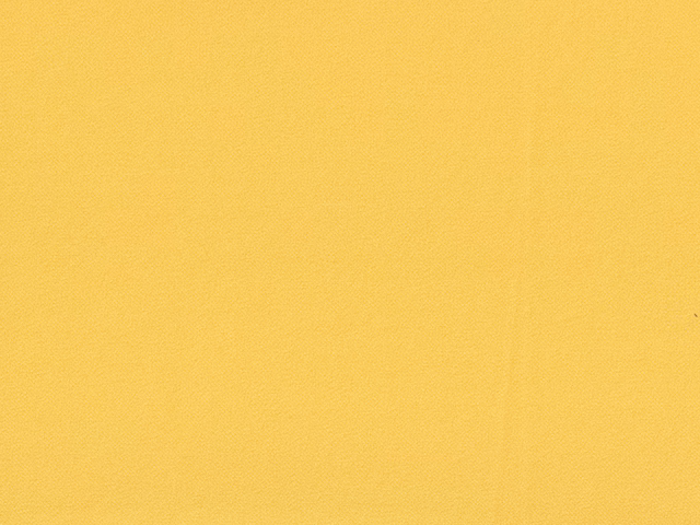 Close-up of warm golden-yellow plain chenille with a softly brushed texture