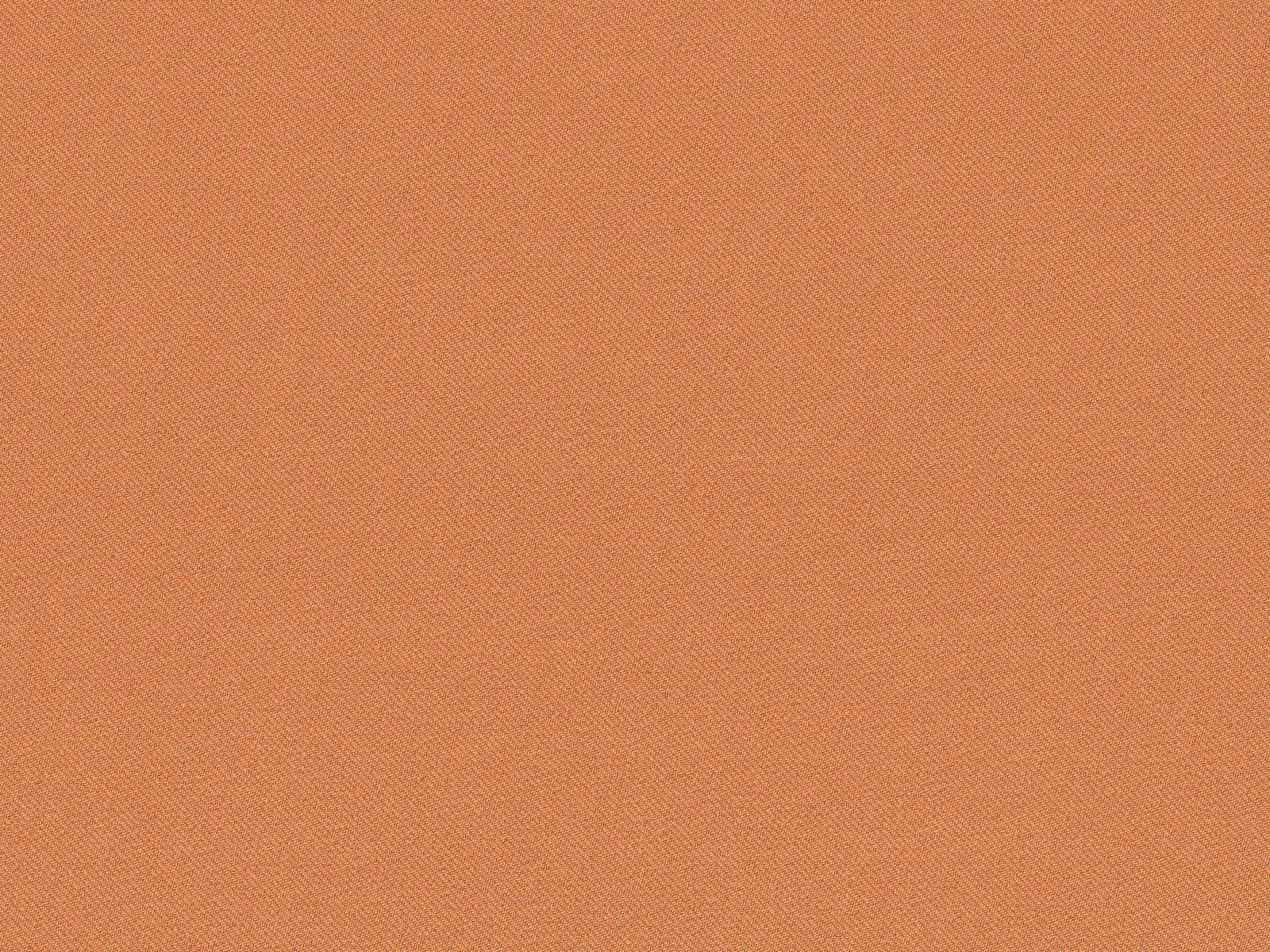 Close-up of muted terracotta chenille with a fine, softly varied woven texture