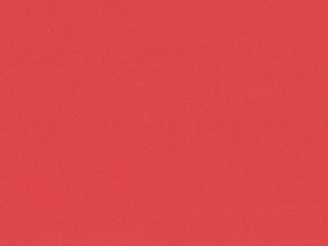 Warm coral-red chenille with a fine diagonal woven texture