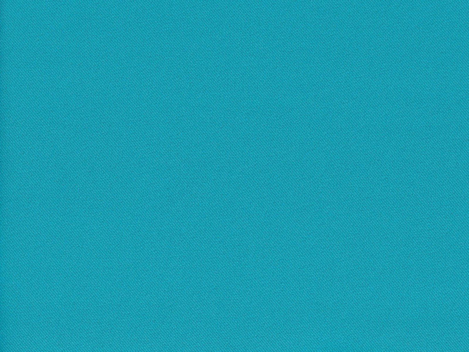 Close-up of bright turquoise teal chenille with a fine diagonal woven texture