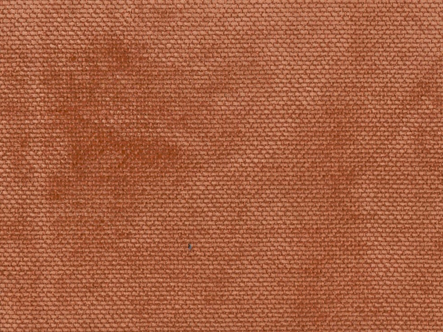 Rust terracotta chenille with fine nubby weave and darker tonal shading