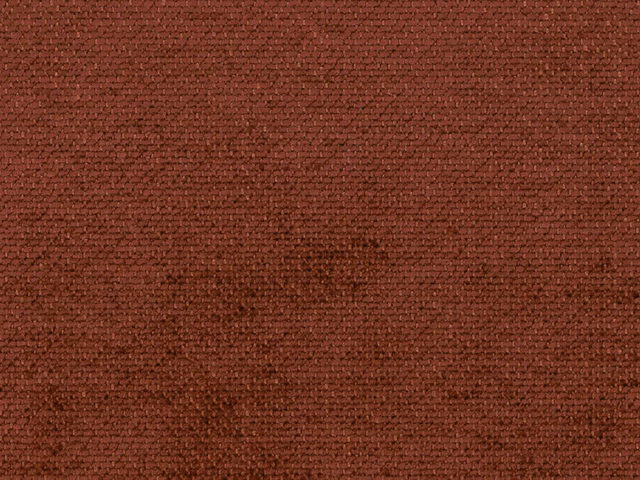 Close-up of deep russet terracotta chenille with a dense, softly mottled weave