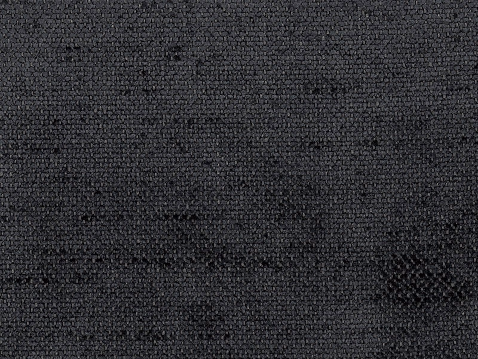 Close-up of deep charcoal-grey chenille with a nubby, subtly mottled woven surface