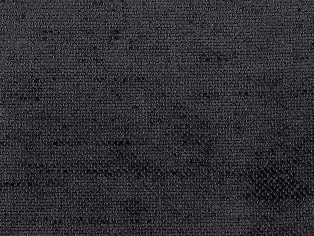 Close-up of deep charcoal-grey chenille with a nubby, subtly mottled woven surface
