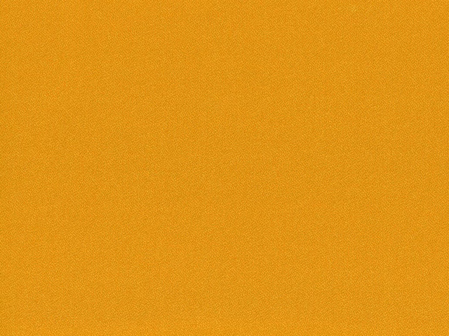 Close-up of warm ochre-gold flat weave with a fine, even woven texture