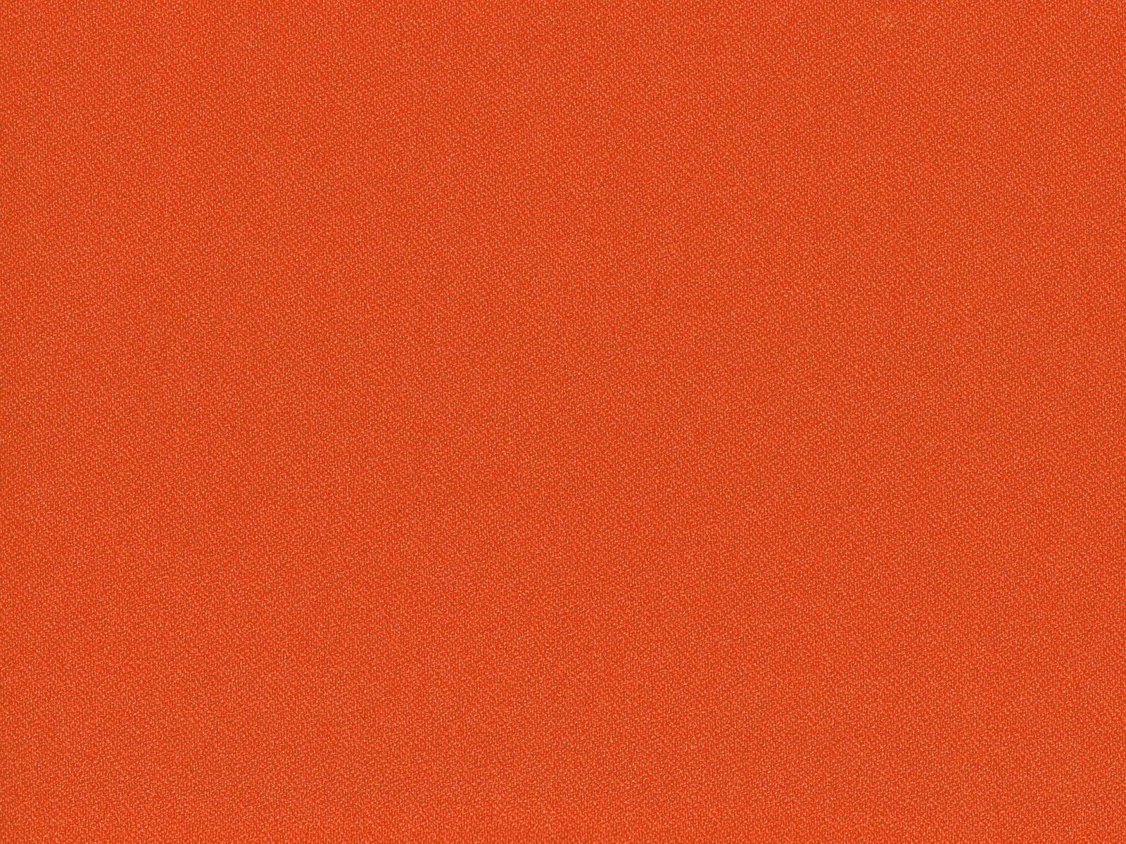 Rust terracotta flat-weave fabric showing a fine, even crosshatch texture