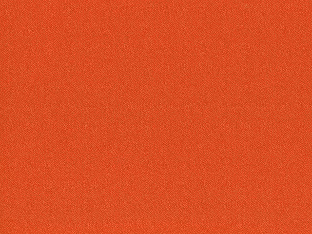 Rust terracotta flat-weave fabric showing a fine, even crosshatch texture