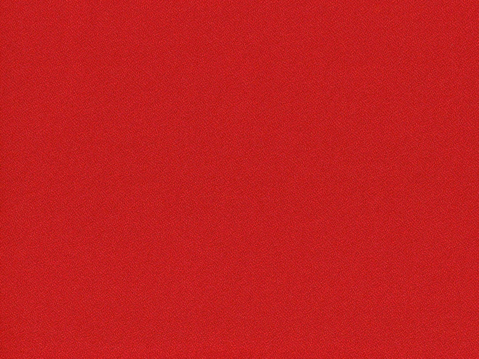 Close-up of rich crimson red flat-weave upholstery with subtle woven texture