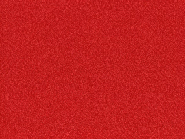 Close-up of rich crimson red flat-weave upholstery with subtle woven texture