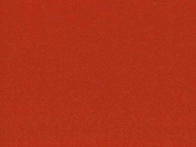 Warm brick-red flat-weave fabric with fine granular woven texture