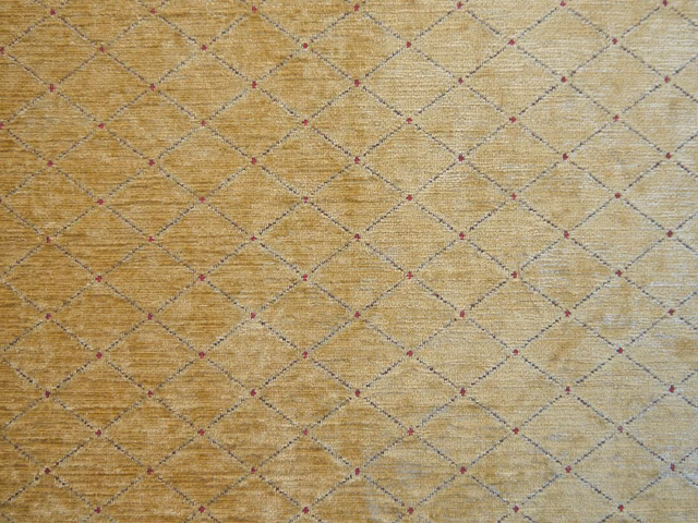 Warm ochre chenille with grey diamond lattice and tiny burgundy points