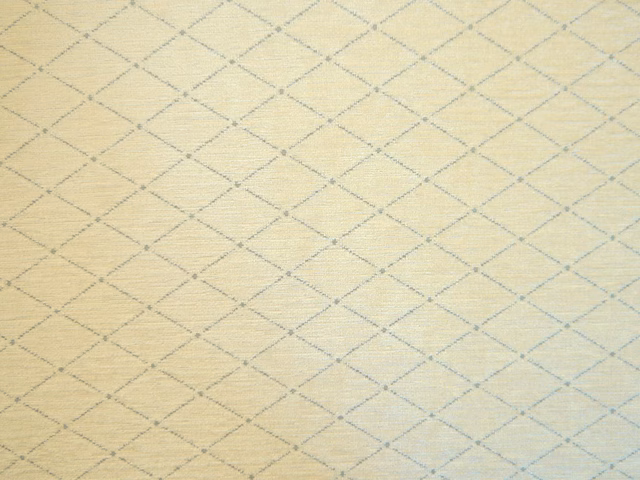 Pale ivory-yellow chenille with a fine blue-grey diamond lattice weave