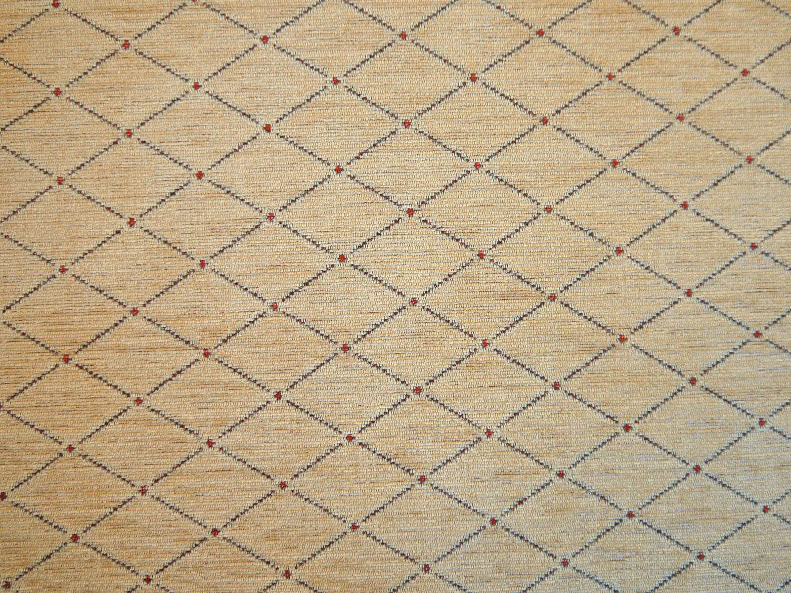 Warm oatmeal chenille with charcoal diamond lattice and tiny red accents