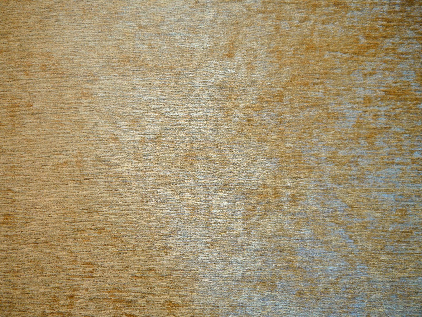 Weathered sand chenille with ochre flecks and blue-grey tonal shading