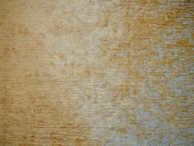 Weathered sand chenille with ochre flecks and blue-grey tonal shading