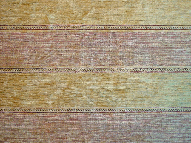 Gold, dusty mauve and aqua chenille with broad horizontal bands and dark braided lines